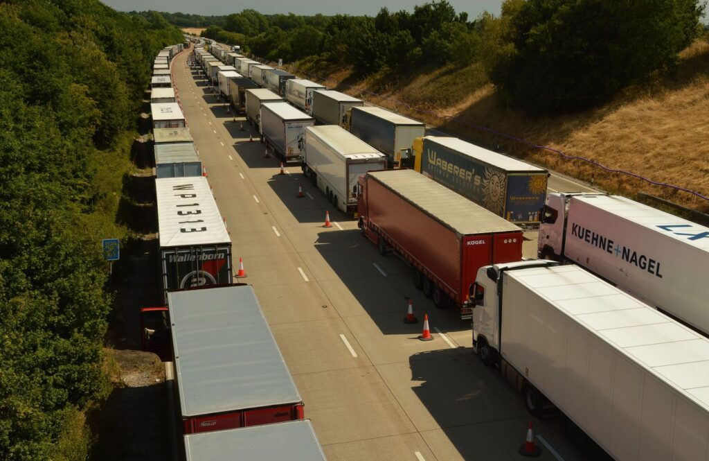 Aerial view of HGV trailers queued on an English motorway